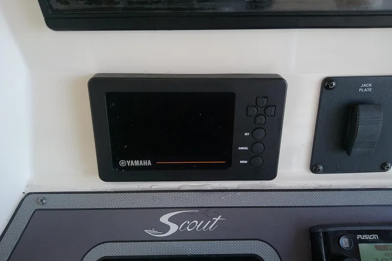 Slide: The Image of Control panel of a 2018 Scout 251 XSS boat featuring Yamaha display. - 51