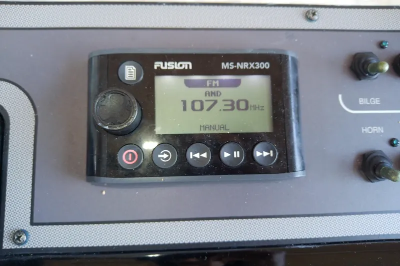 Slide: The Image of Fusion MS-NRX300 radio display on 2018 Scout 251 XSS boat dashboard. - 53