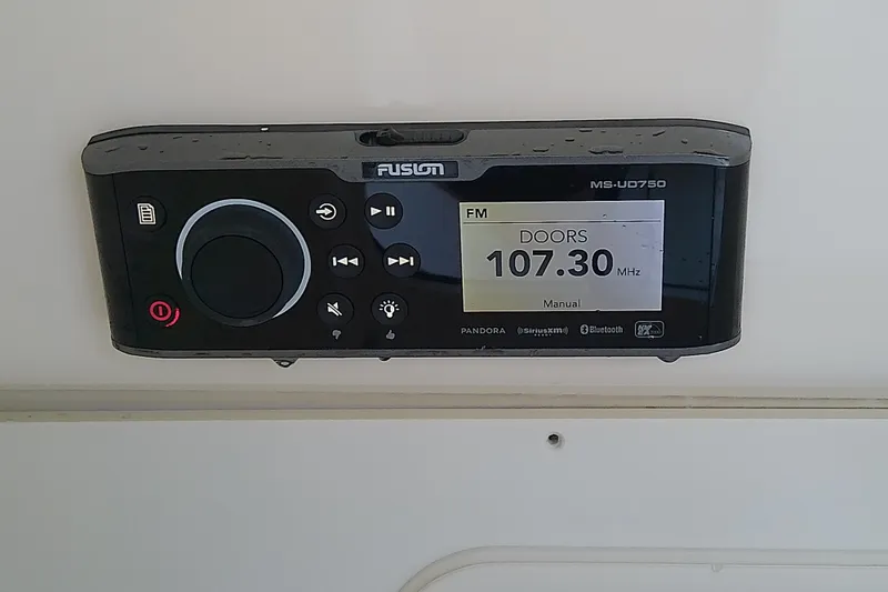 Slide: The Image of Fusion MS-UD750 stereo system displaying FM 107.30 MHz on a 2018 Scout 251 XSS. - 59