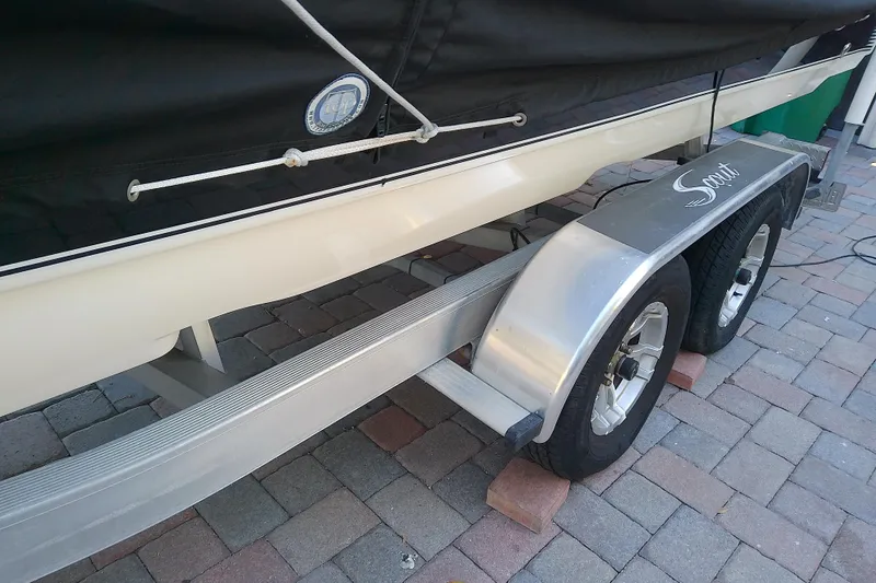 Slide: The Image of 2018 Scout 251 XSS boat on trailer, parked on brick pavement. - 70