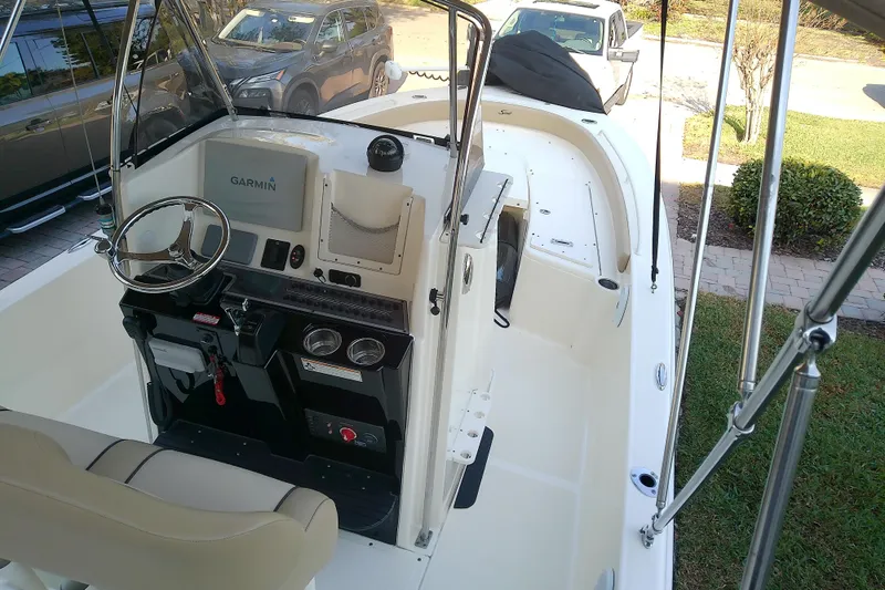 Slide: The Image of 2018 Scout 251 XSS boat interior with Garmin navigation system and steering wheel. - 83