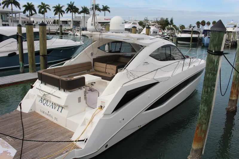 The Image of 2017 Galeon 385 HTS yacht docked at marina with palm trees in background. - 0