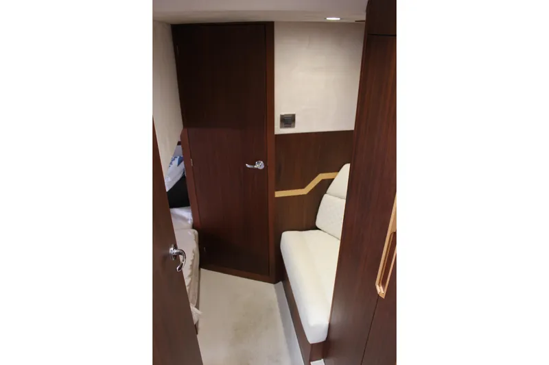 Slide: The Image of Interior of 2017 Galeon 385 HTS yacht with wooden finish and white seating. - 19