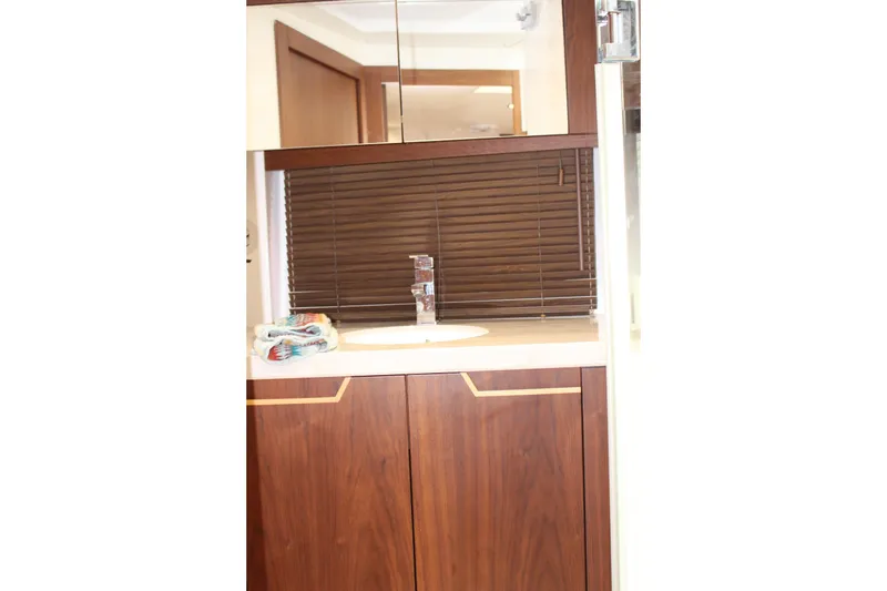 Slide: The Image of Luxurious bathroom interior of 2017 Galeon 385 HTS yacht with wooden cabinetry and modern fixtures. - 20