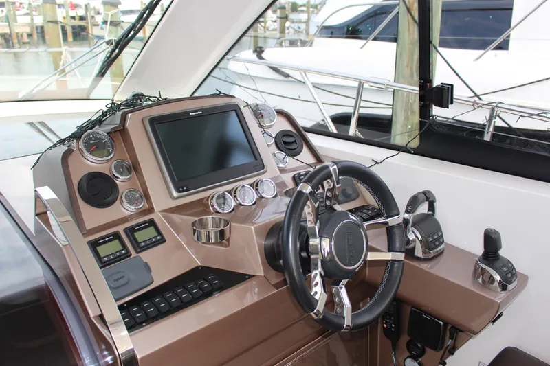 Slide: The Image of 2017 Galeon 385 HTS helm with modern controls and navigation display. - 4