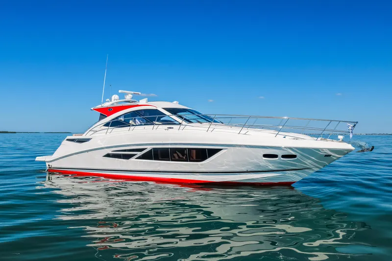 The Image of 2016 Sea Ray 510 Sundancer yacht on calm blue water under clear sky. - 0