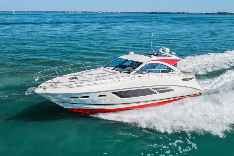 Slide: The Image of 2016 Sea Ray 510 Sundancer cruising on clear blue water. - 17