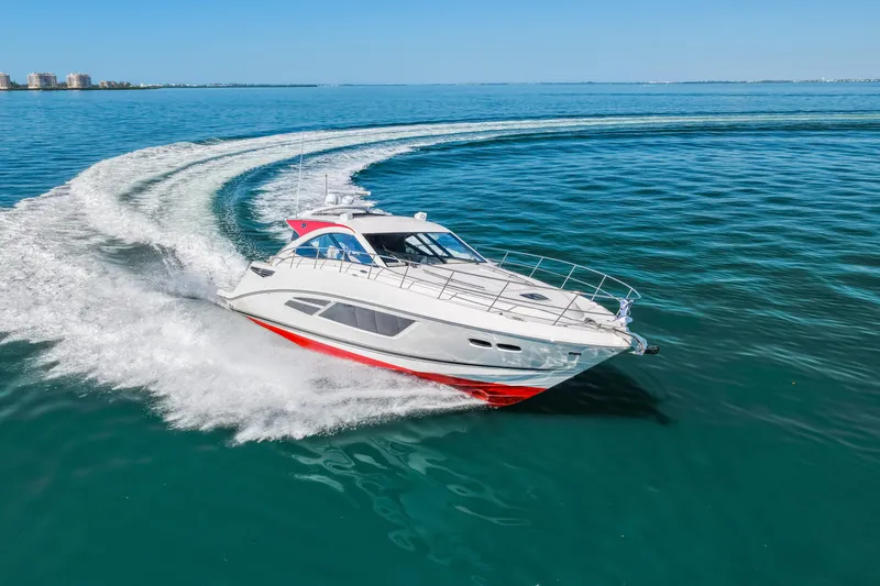 Slide: The Image of 2016 Sea Ray 510 Sundancer yacht cruising on open water. - 20