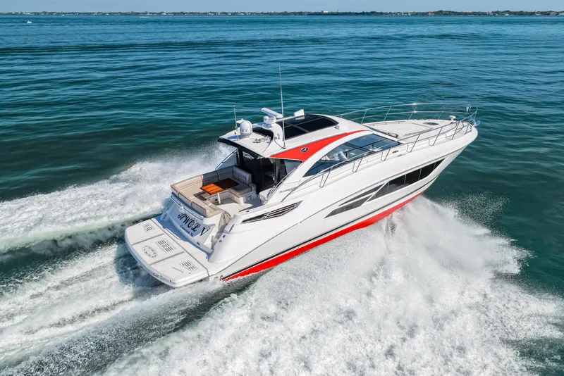 Slide: The Image of 2016 Sea Ray 510 Sundancer yacht cruising on open water. - 23