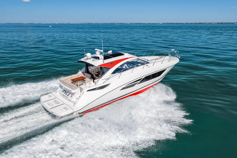 Slide: The Image of 2016 Sea Ray 510 Sundancer cruising on open water, showcasing sleek design and performance. - 24