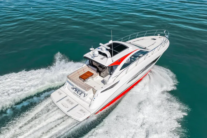 Slide: The Image of 2016 Sea Ray 510 Sundancer cruising on open water, showcasing sleek design and performance. - 25