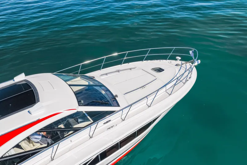 Slide: The Image of 2016 Sea Ray 510 Sundancer yacht on clear blue water, top view. - 3