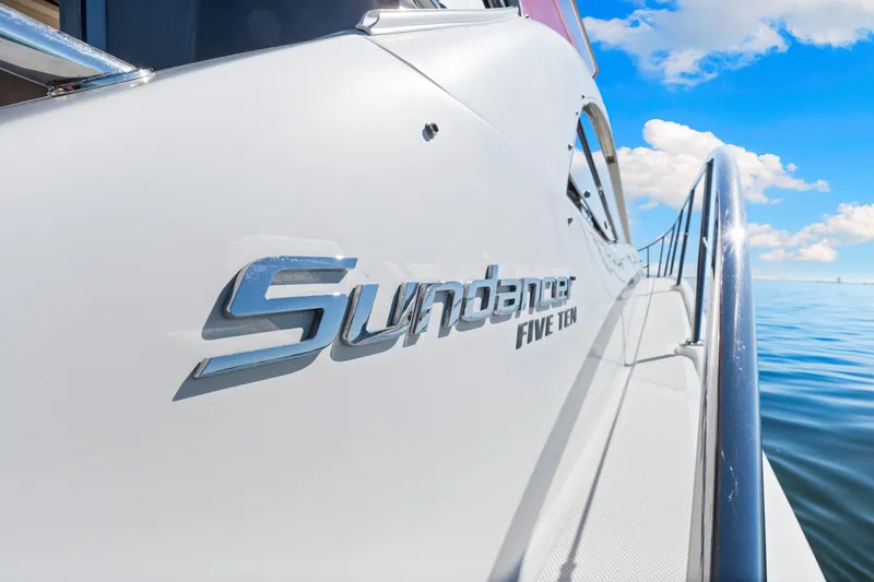Slide: The Image of 2016 Sea Ray 510 Sundancer yacht on calm water under blue sky. - 41