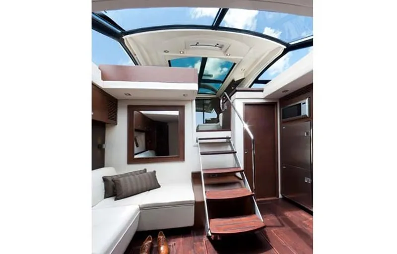 Slide: The Image of Manufacturer Provided Image: Interior of 2016 Sea Ray 510 Sundancer yacht with modern design and skylight. - 56