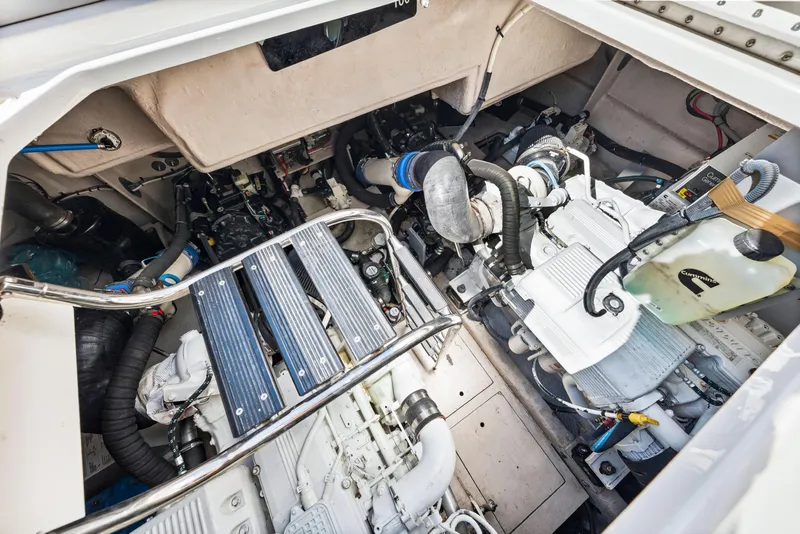 Slide: The Image of Engine room of 2016 Sea Ray 510 Sundancer yacht, showcasing mechanical components and systems. - 66