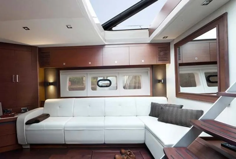 Slide: The Image of Manufacturer Provided Image: Luxurious interior of 2016 Sea Ray 510 Sundancer yacht with white leather seating. - 70