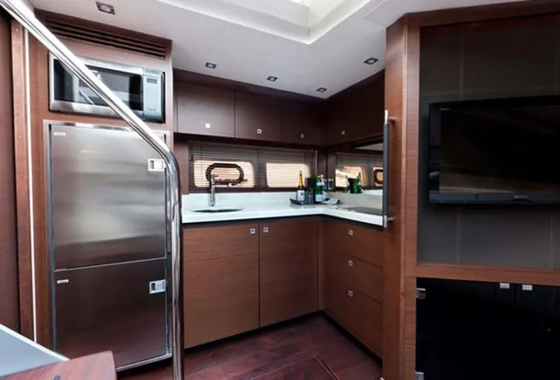 Slide: The Image of Manufacturer Provided Image: Modern kitchen interior of 2016 Sea Ray 510 Sundancer yacht with stainless steel appliances. - 71