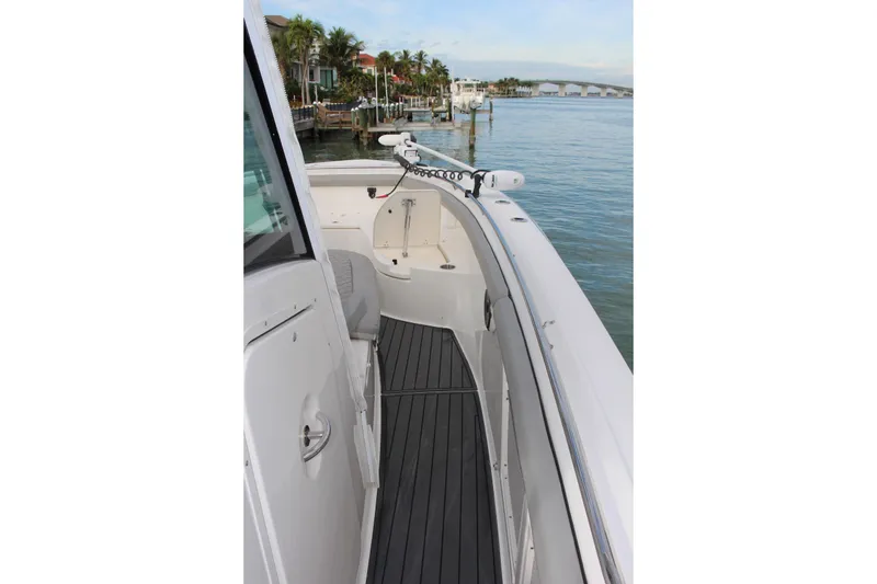 Slide: The Image of 2020 Boston Whaler 350 Outrage boat deck with scenic waterfront view. - 15