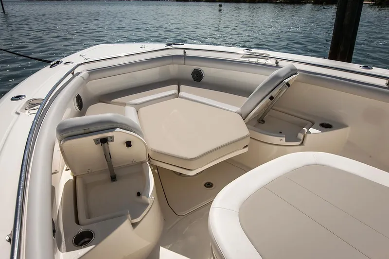 Slide: The Image of Manufacturer Provided Image: 2020 Boston Whaler 350 Outrage boat interior with cushioned seating and table. - 16