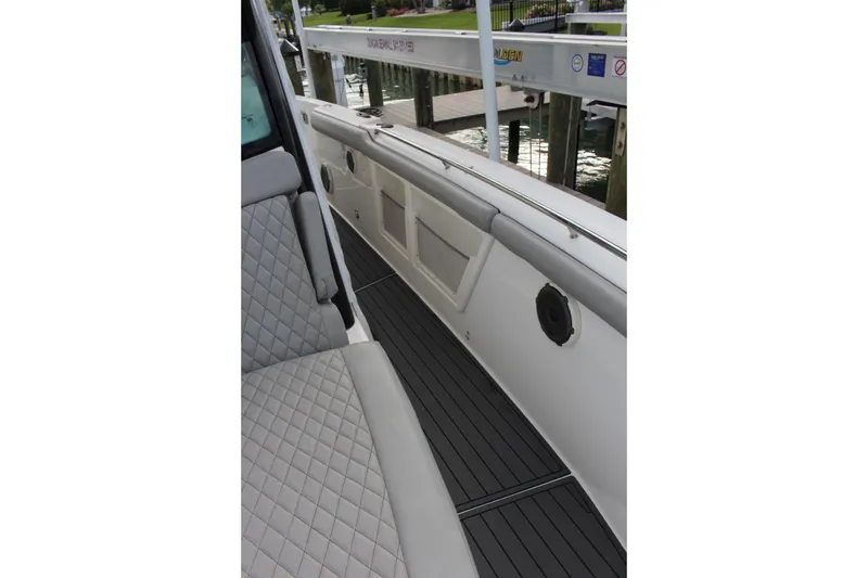 Slide: The Image of 2020 Boston Whaler 350 Outrage interior with quilted seating and sleek deck design. - 21