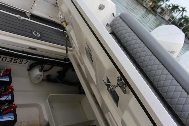 Slide: The Image of Boston Whaler 350 Outrage 2020 boat interior with storage compartment and seating. - 25