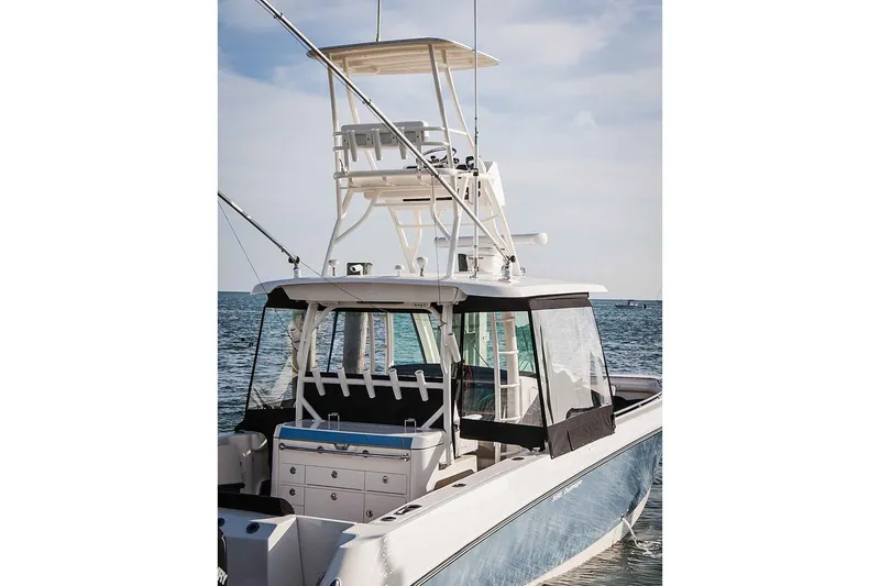 Slide: The Image of Manufacturer Provided Image: 2020 Boston Whaler 350 Outrage boat on the water, rear view. - 31