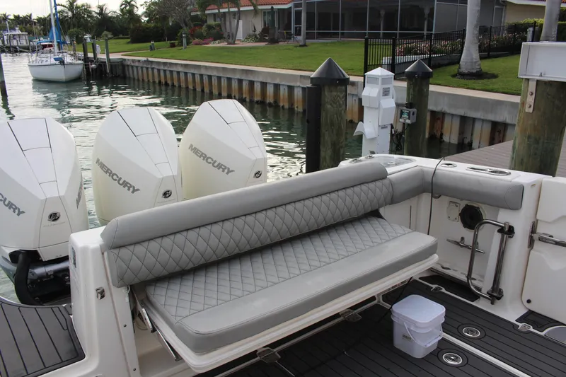 Slide: The Image of 2020 Boston Whaler 350 Outrage with Mercury engines, docked with luxurious seating. - 5
