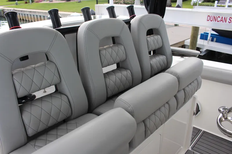 Slide: The Image of Luxurious seating on 2020 Boston Whaler 350 Outrage boat with quilted gray upholstery. - 7