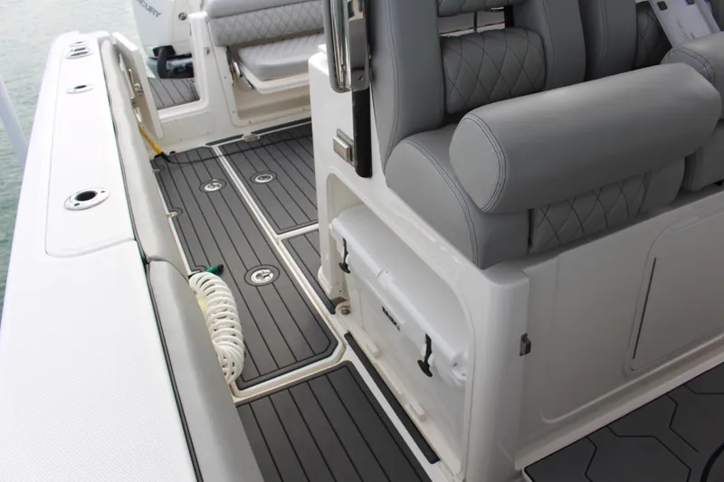 Slide: The Image of 2020 Boston Whaler 350 Outrage interior with gray seating and deck details. - 8