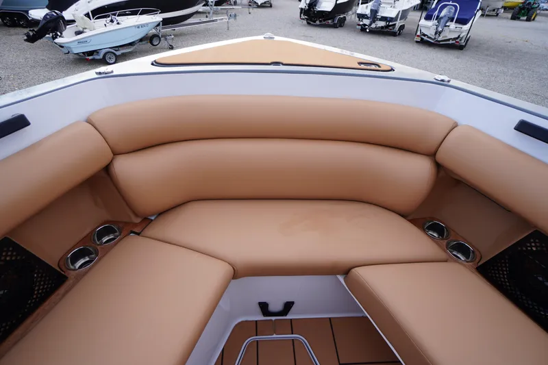 Slide: The Image of Luxurious tan seating in 2020 Aviara AV32 OB boat, featuring cup holders and spacious design. - 10