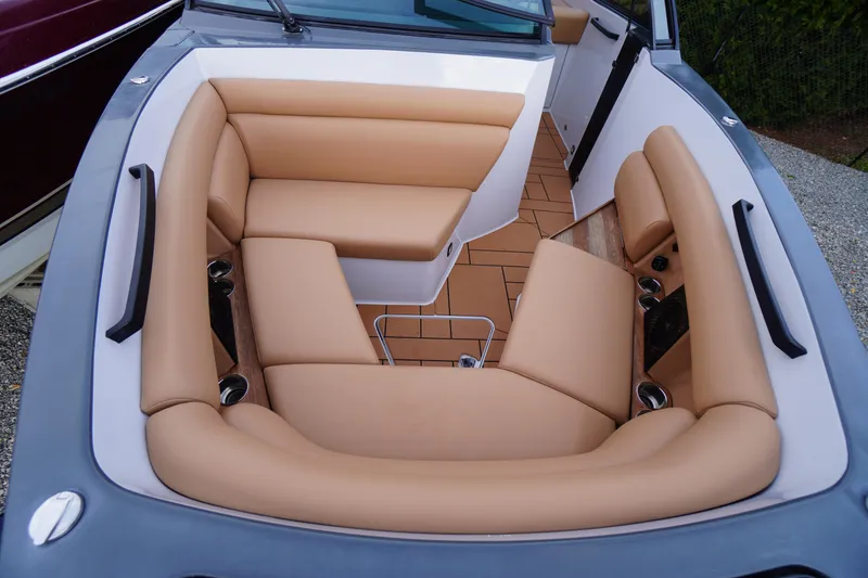 Slide: The Image of 2020 Aviara AV32 OB boat interior with tan leather seating and cup holders. - 14