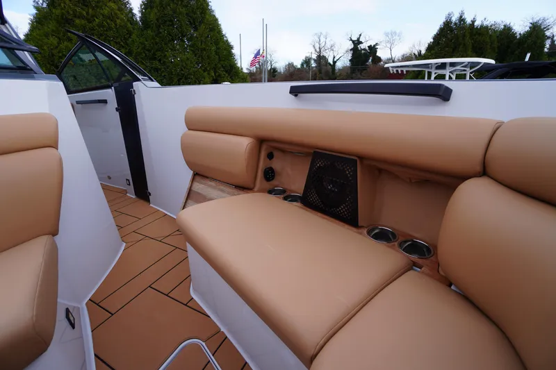 Slide: The Image of Luxurious seating area on 2020 Aviara AV32 OB boat with tan upholstery and cup holders. - 15
