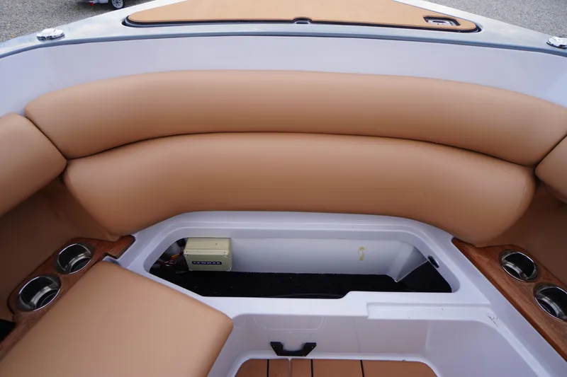Slide: The Image of 2020 Aviara AV32 OB boat interior with tan seating and storage compartment. - 18