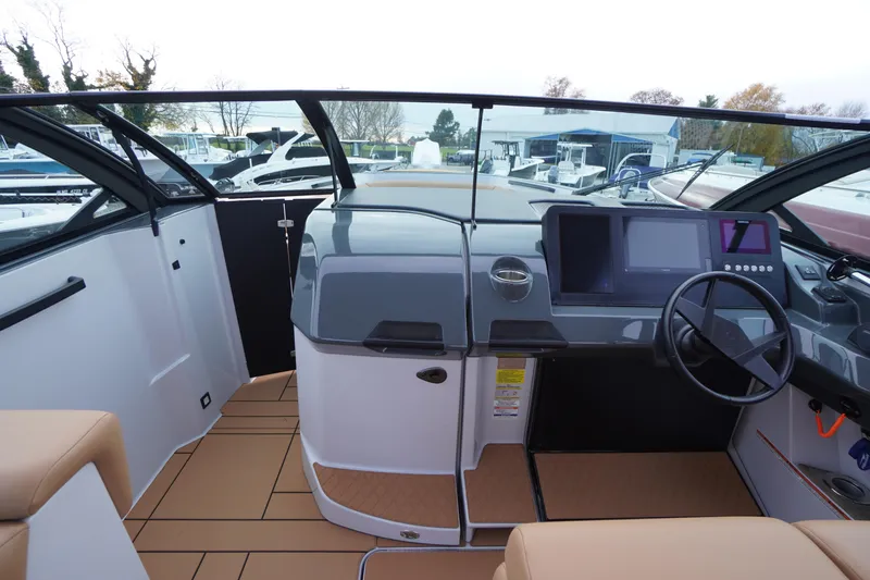 Slide: The Image of 2020 Aviara AV32 OB boat cockpit with modern dashboard and steering wheel. - 23