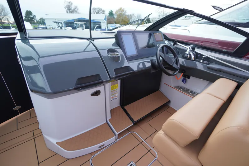 Slide: The Image of 2020 Aviara AV32 OB boat cockpit with modern dashboard and tan seating. - 25