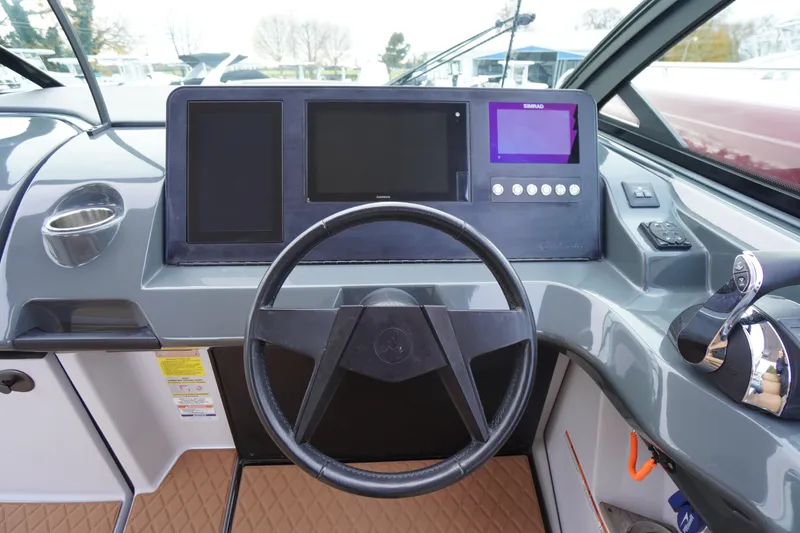 Slide: The Image of 2020 Aviara AV32 OB helm with modern controls and navigation displays. - 26