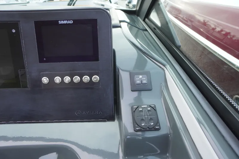 Slide: The Image of 2020 Aviara AV32 OB dashboard with Simrad display and control panel. - 27