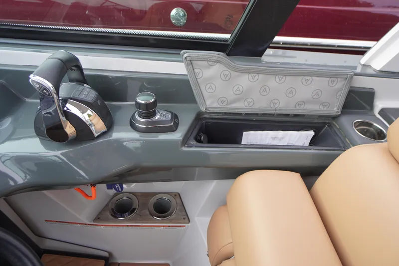 Slide: The Image of 2020 Aviara AV32 OB boat interior with controls and storage compartment. - 29