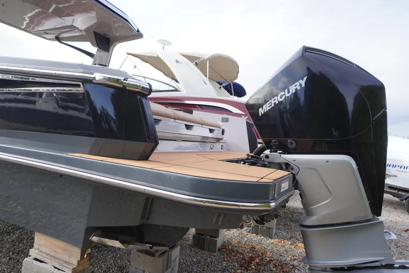 Slide: The Image of 2020 Aviara AV32 OB boat with Mercury outboard engine, displayed on blocks. - 3