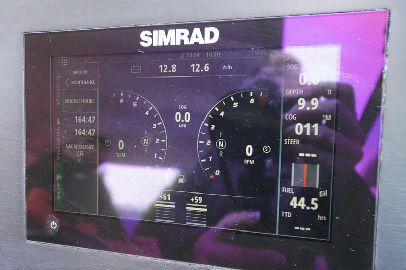 Slide: The Image of Simrad display on 2020 Aviara AV32 OB showing engine and navigation data. - 30