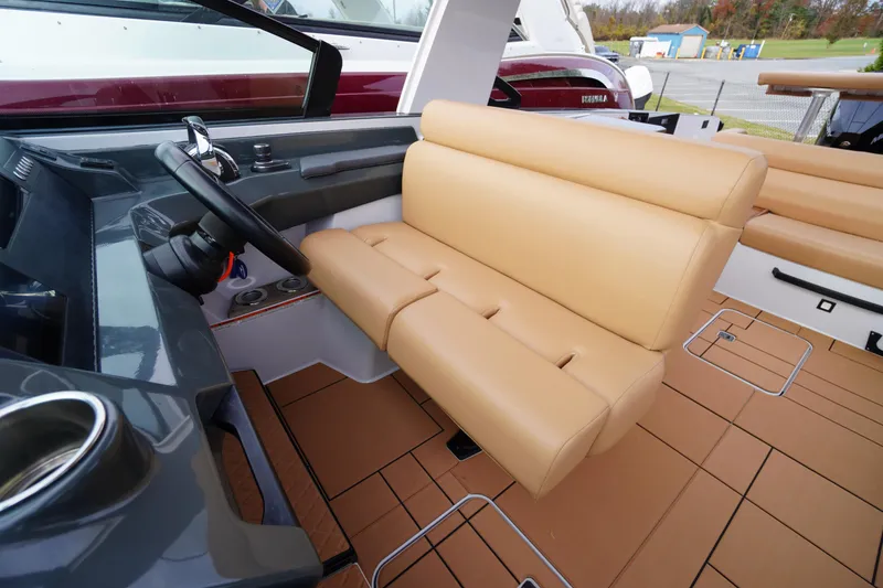 Slide: The Image of 2020 Aviara AV32 OB boat interior with tan leather seating and modern helm. - 39