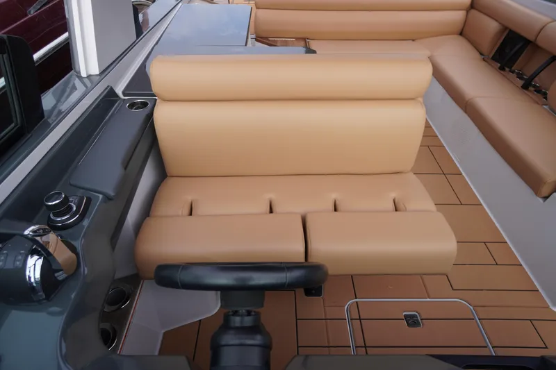 Slide: The Image of 2020 Aviara AV32 OB boat interior with tan leather seating and modern controls. - 40