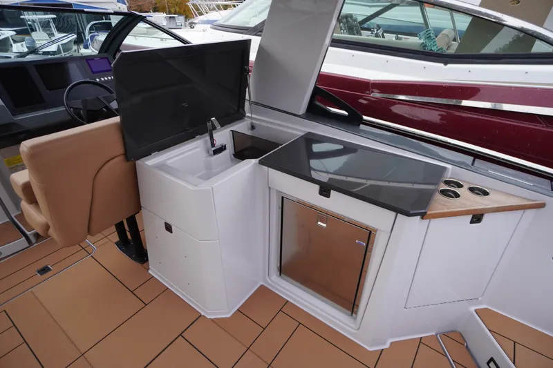 Slide: The Image of Luxury Aviara AV32 OB 2020 boat interior with sleek kitchenette and modern amenities. - 42