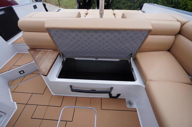 Slide: The Image of 2020 Aviara AV32 OB boat with open storage compartment and tan seating. - 52