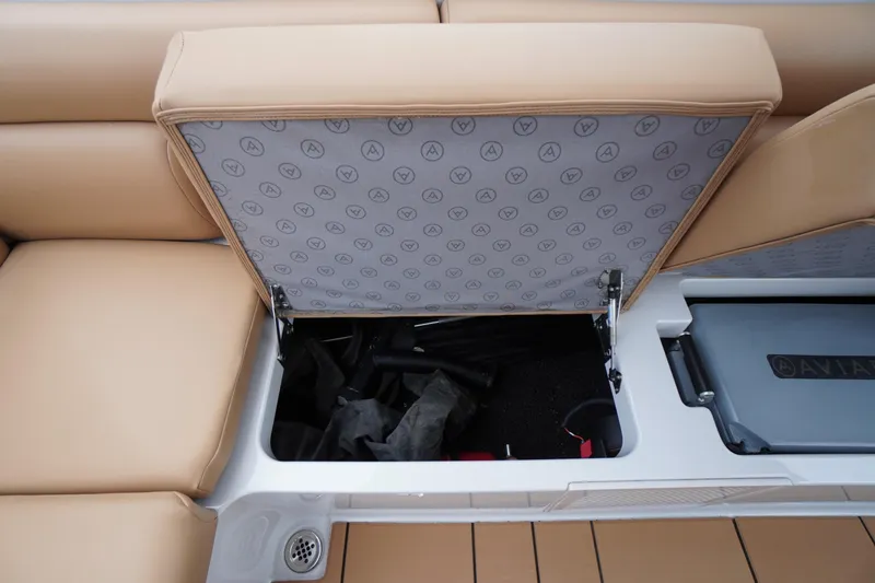 Slide: The Image of 2020 Aviara AV32 OB boat storage compartment with tan seating and branded interior. - 54