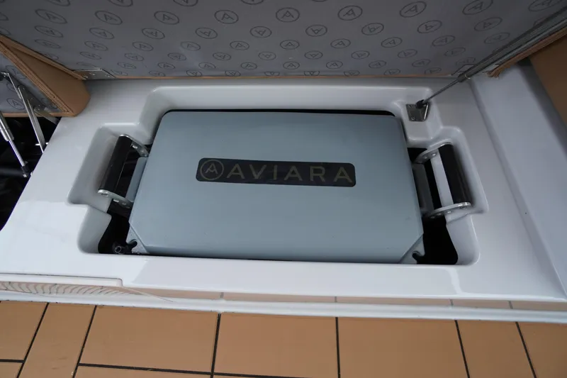 Slide: The Image of Aviara AV32 OB 2020 boat storage compartment with branded cover. - 56