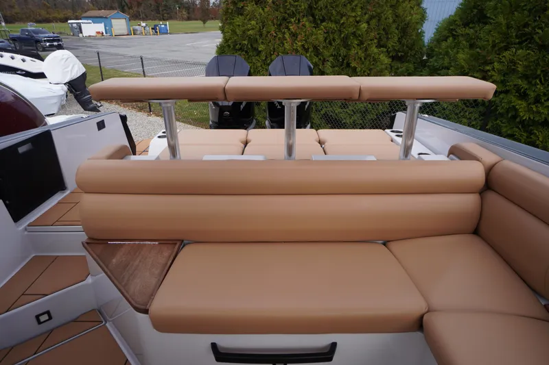 Slide: The Image of 2020 Aviara AV32 OB boat with tan seating and dual outboard motors. - 57