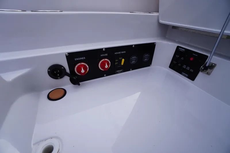 Slide: The Image of Control panel of 2020 Aviara AV32 OB boat, featuring engine and house switches. - 60