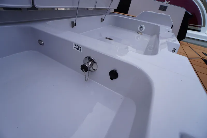 Slide: The Image of 2020 Aviara AV32 OB boat deck with fresh water access and sleek design. - 61