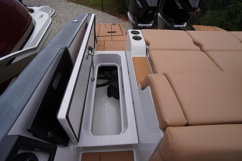 Slide: The Image of 2020 Aviara AV32 OB boat interior with storage compartment and tan seating. - 68